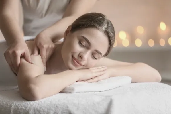 Therapist working on a client's shoulders
